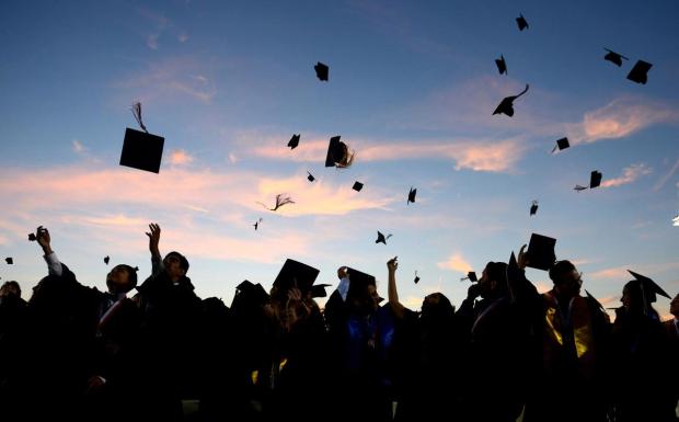 Throwing caps into the air. Photo courtesy of https://www.google.com/url?sa=i&url=https%3A%2F%2Fwww.ocregister.com%2F2016%2F06%2F17%2Fgraduation-2016-tustin-high-says-farewell-to-473-seniors-gives-one-a-new-car%2F&psig=AOvVaw1SRUcs217VY5yqKbyBbO4_&ust=1600969946374000&source=images&cd=vfe&ved=0CAIQjRxqFwoTCKjSw4Ds_-sCFQAAAAAdAAAAABAD